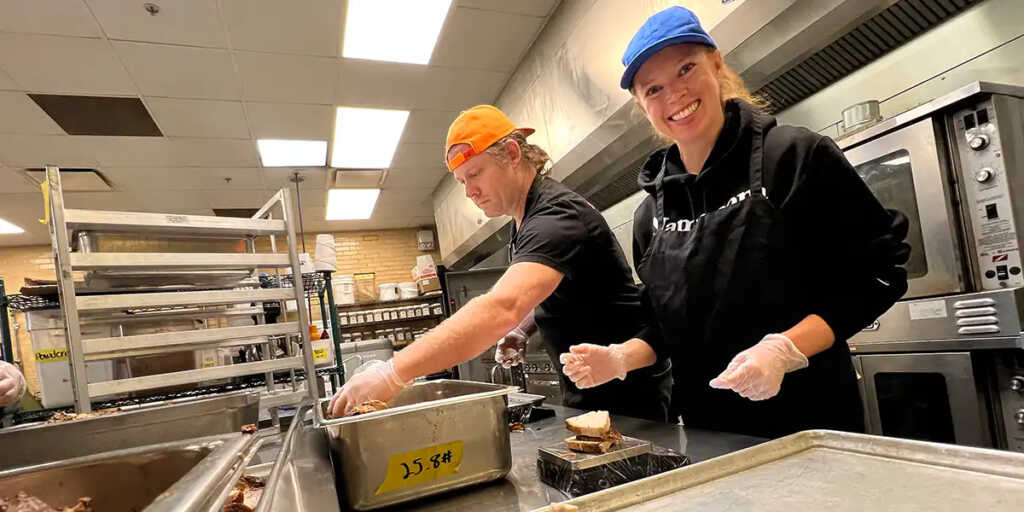 Ryan and Sheryl from Name.com pack meals at Project Angel Heart